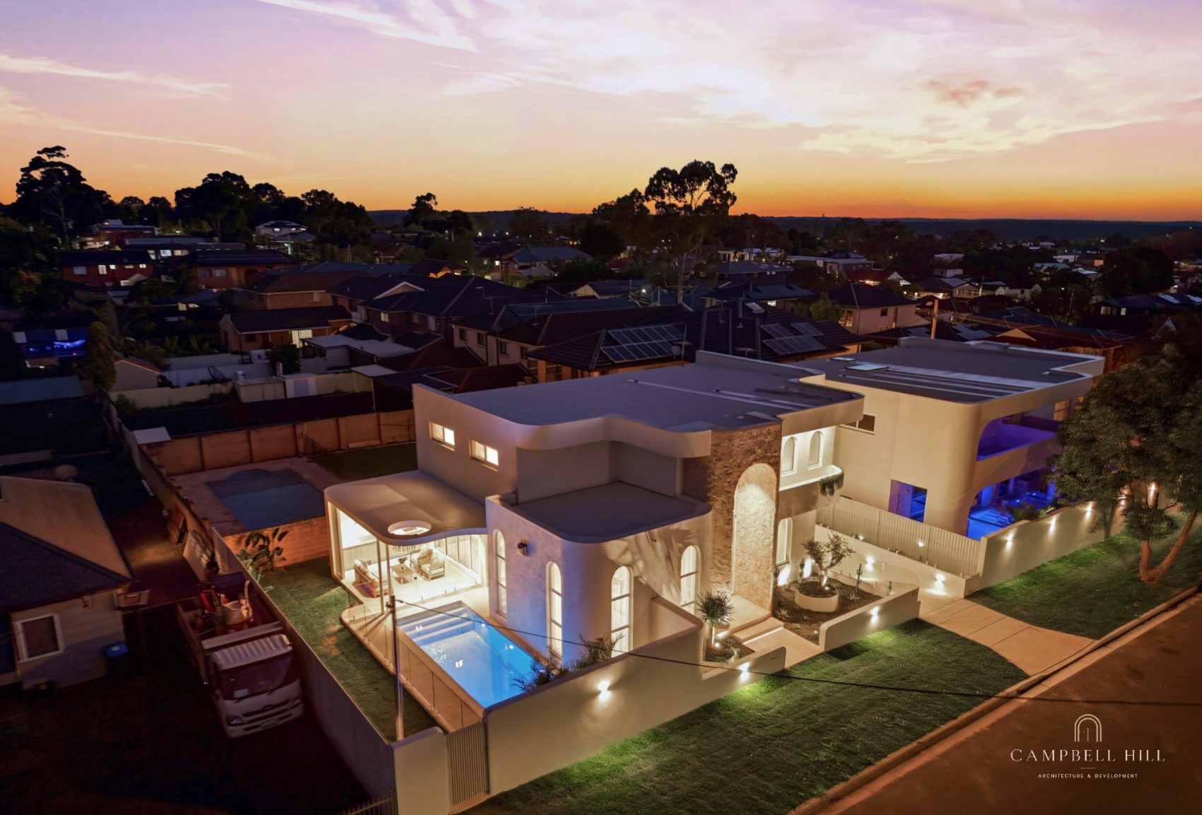 Aerial view of the site at dusk
