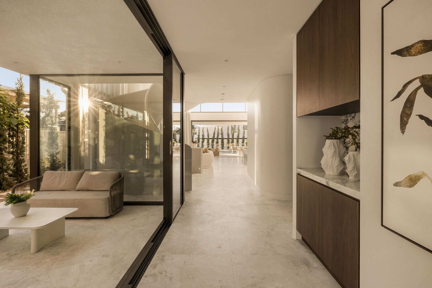 Entry gallery with stone floors and timber joinery