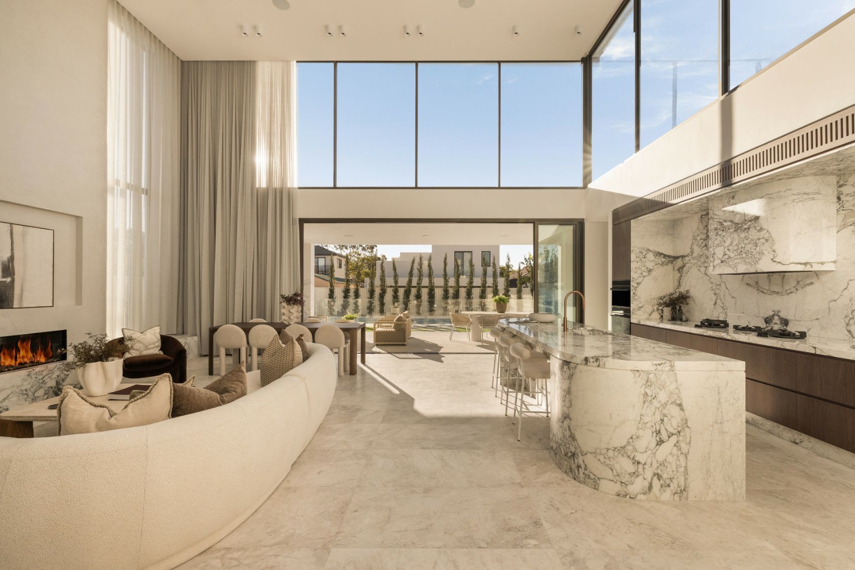 Open-plan living opening to the pool terrace